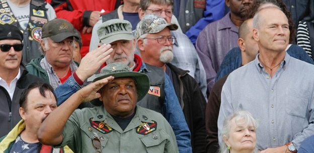 Former soldiers salute during the playing of the Army Song at Vietnam Veterans Salute Day, Joint Base Lewis-McChord, Wash., October 9. The event was held to honor Vietnam Veterans by giving them a welcome home that many never received. (U.S. Army photo by Sgt. Cody Quinn 28th Public Affairs Detachment/Released)