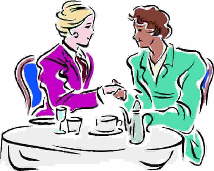 Two people shaking hands at a business meeting