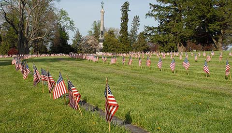 Flags adorn the graves of American soldiers killed during the Battle of Gettysburg, fought July 1-3, 1863 between the Union Army of the Potomac and the Confederate Army of Northern Virginia. The soldiers are buried in the National Cemetery at Gettysburg, Pennsylvania.