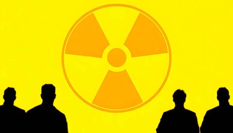 nuclear symbol illuminated against a bright yellow background with silhouettes observing